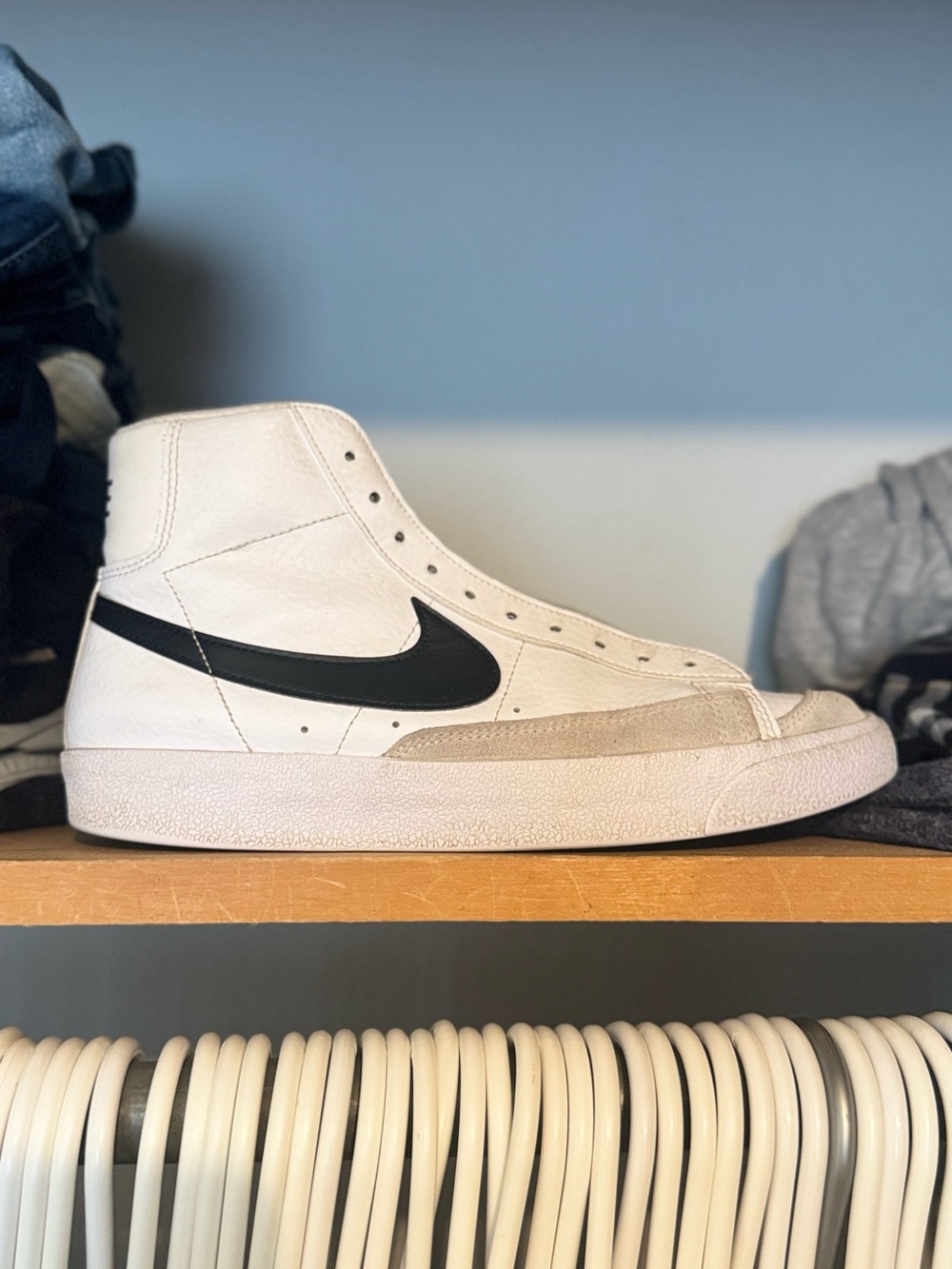 Nike White High-Top Sneaker with Black Swoosh and Tan Suede Accent